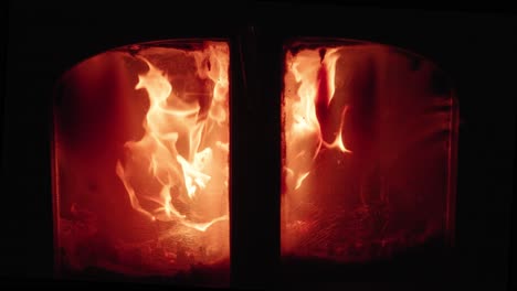 An-old-woodstove-with-pretty-flames-from-dry-wood---slow-motion
