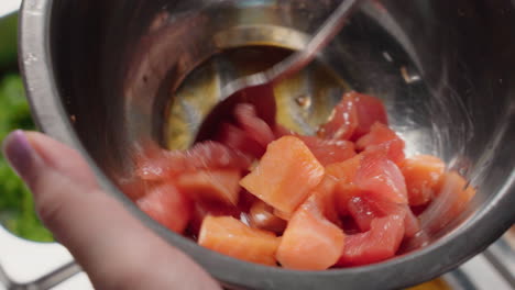 Mixing-Diced-And-Uncooked-Salmon-And-Tuna-Fish-With-Soy-Sauce