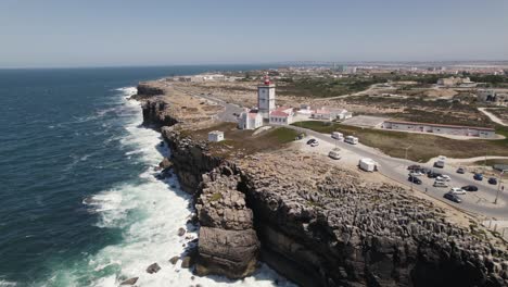 Aerial-orbiting-view-Coastal-lighthouse-of-Cabo-Carvoeiro,-Peniche---Portugal
