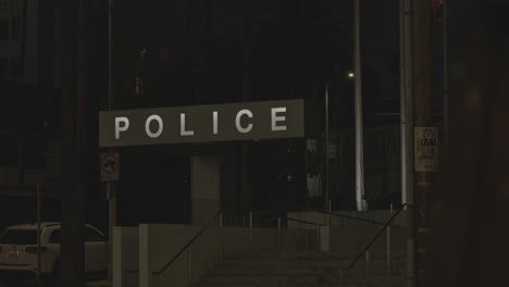 Static-Close-up-Of-A-LED-Police-Sign-Outside-A-Police-Station-And-Headquarters