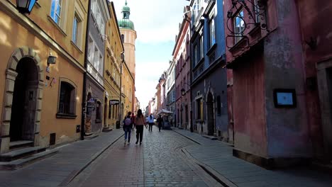 Walking-Down-The-Cobblestone-Street-In-Old-Town-Of-Warsaw-In-Poland