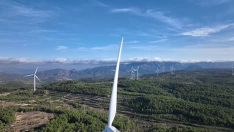 Awe-inspiring-view-over-a-wind-farm-in-the-mountains-with-beautiful-blue-sky
