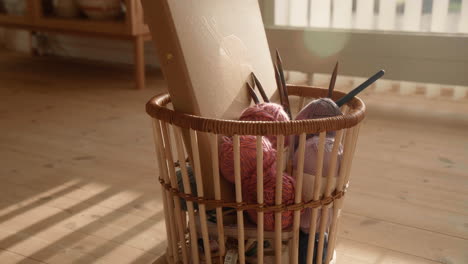 Knitting-equipment-in-a-basket-wool-and-needles-sunlit-living-room-lense-flare-4K