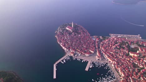 Hazy-day-at-iconic-mediterranean-town-Rovinj,-drone-view