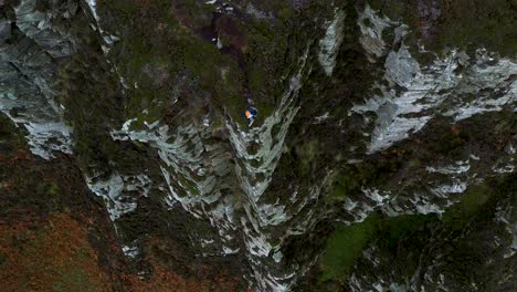 Thrill-Seeker-on-Tall-Cliff's-Edge-of-Horn-Head,-Donegal,-Ireland---Aerial