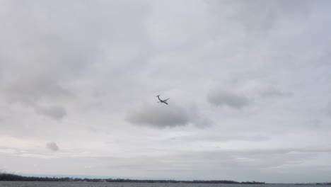 A-plane-flying-over-water-to-it's-destination