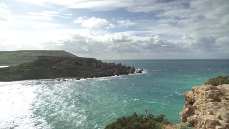 Ghajn-Tuffieha-Bay-with-Il-Qarraba-Rock-and-Raging-Turquoise-Colour-Mediterranean-Sea