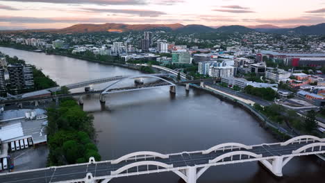Cinematic-Drone-above-Brisbane-Bridge-with-Mt-Cootha-in-distance---Train