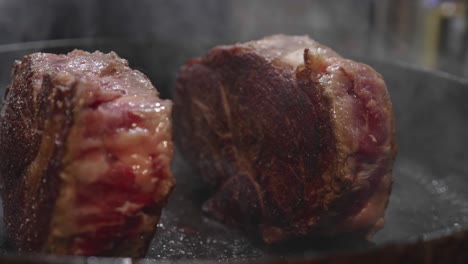 Big-beef-steaks-grilled-inside-frying-pan
