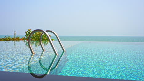 An-infinity-edge-swimming-pool-seems-to-stretch-out-to-connect-the-with-ocean-horizon-in-the-distance