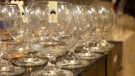 Close-Up-Footage-of-Wine-Glasses-Displaying-On-The-Shelf-At-Mall