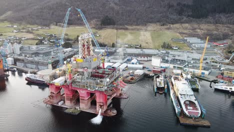Ships-and-rigs-at-Westcon-shipyard-Ølen-Norway---Aerial-overview---Zero-emission-ferries-beeing-built