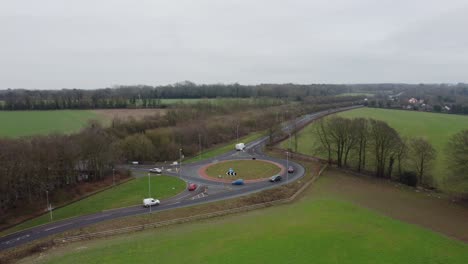 Drone-moving-away-from-a-British-roundabout-in-the-countryside
