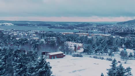 Moving-aerial-scene-revealing-Östersund-city-in-Sweden-on-winter-day