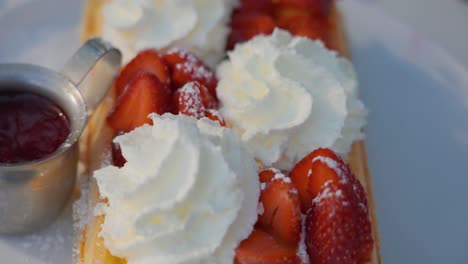 Pan-Down-of-Dessert-Waffles,-whipped-cream-and-strawberries