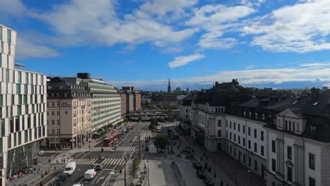 Wide-street-Vasagatan-plaza-traffic-in-Stockholm-Sweden,-beautiful-day