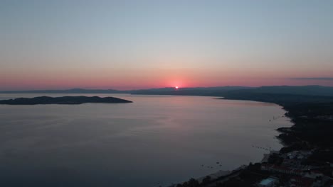 Drone-shot-a-sunrise-over-the-beach-in-Greece