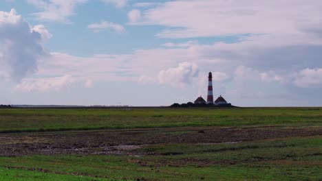 Wide-shot-from-a-daylight-timelapse-of-a-lighthouse-near-the-North-Sea