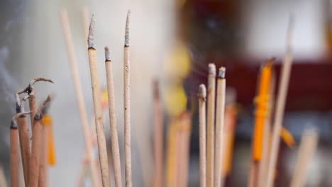 Handheld-close-up-view-of-Incense-burning-with-background-blur-in-slow-motion