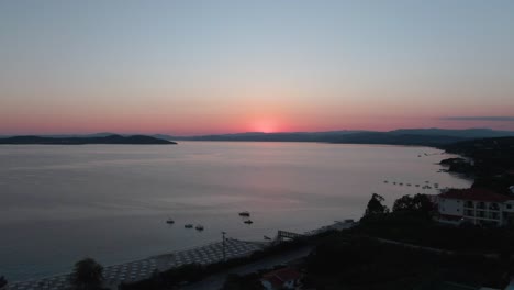 Drone-shot-a-sunrise-over-the-beach-in-Greece