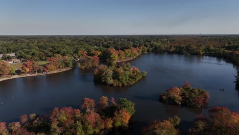An-aerial-view-of-Belmont-State-Park-on-Long-Island,-NY-on-a-sunny-day-with-beautiful-fall-foliage