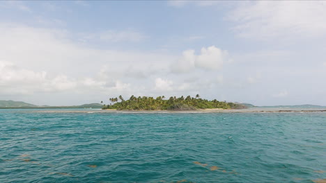 Small-islet-on-the-way-to-Cayo-Icacos-island-in-Puerto-Rico,-sideways,-sunny-day