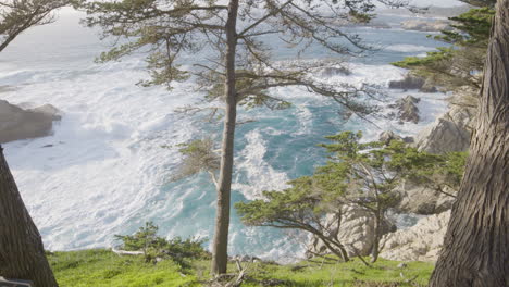 Stationary-shot-of-Waves-rolling-through-the-pacific-ocean-while-the-tide-recedes-at-Big-Sur-California-beach