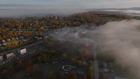Sherbrooke-Town-During-Autumn-Season-With-Colorful-Trees-And-Misty-Clouds-In-Quebec,-Canada