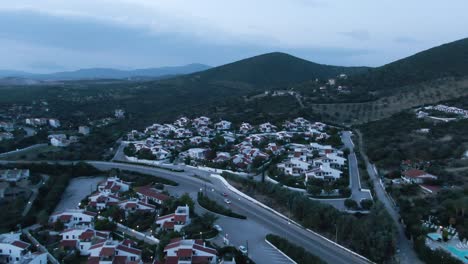 Drone-shot-over-houses-in-Greece-in-sunrise