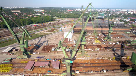 Aerial-drone-of-construction-site,-cranes,-urban-development,-crane