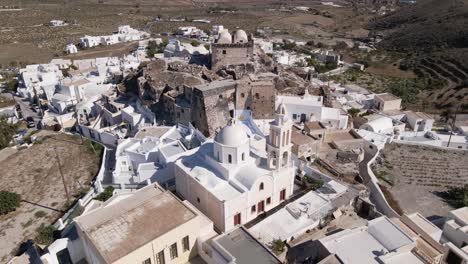 Aerial-view-of-Venetian-Castle-and-bell-tower-at-Akrotiri-village-in-Santorini,-Greece
