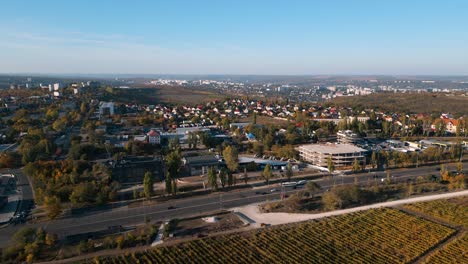 Bird-view-and-drone-flyover-the-Hincesti-Hwy-M3-highway-with-heavy-traffic-in-autumn---panoramic-aerial-drone-view-over-the-city-of-Chisinau,-Republic-of-Moldova-2022