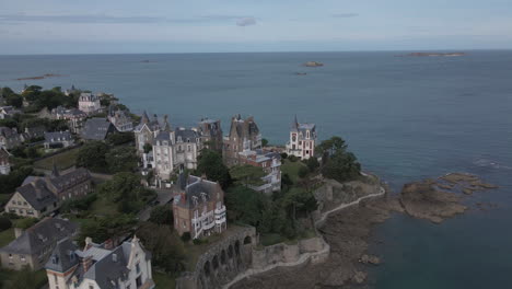 Aerial-forward-over-emerald-coast-at-Dinard,-Brittany-in-France