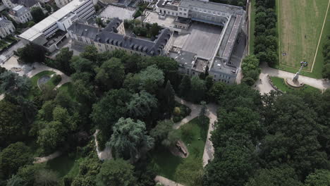 Drone-flying-over-Thabor-Park-and-Anne-de-Bretagne-College,-Rennes-in-France