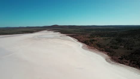 Drone-flyover-Majestic-Lake-Gairdner,-Pink-and-white-colored-salt-flat-lake,-Australia