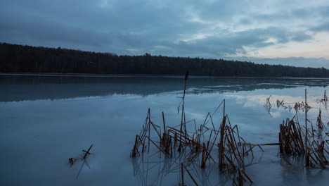 Time-lapse-of-clouds-passing-over-a-frozen-lake-in-northern-Michigan