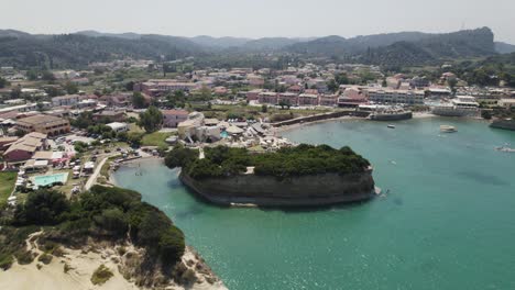 Drone-flight-along-scenic-coastline-of-touristy-Sidari,-Corfu,-Greece