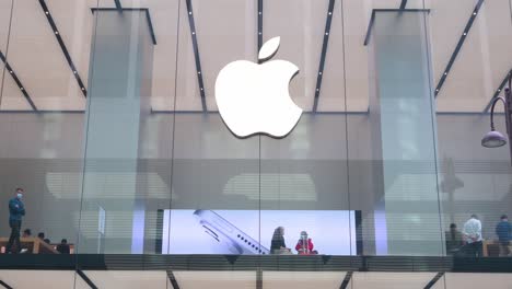 Clients-are-seen-at-the-multinational-American-technology-brand-Apple-store-and-logo-in-Hong-Kong