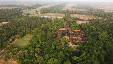 Angkor-temple-Aerial,-Banteay-Samre,-nested-in-the-mystic-Cambodian-jungle,-drone-rotation-footage