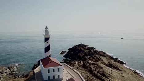 Aerial-View-Of-Favaritx-Lighthouse-On-The-Mediterranean-Island-of-Menorca-In-Spain---drone-shot
