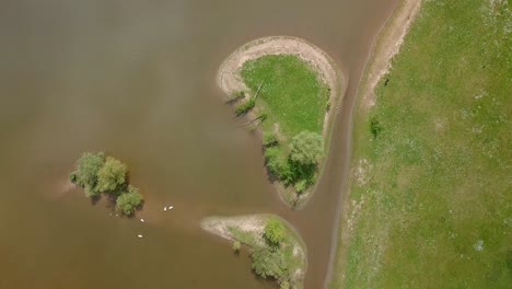 Aerial-drone-view-of-the-top-down-shot-over-the-small-islands-at-the-lake-in-the-Netherlands