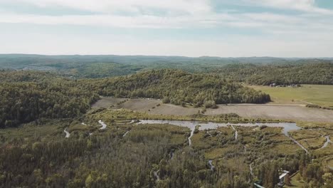 Gorgeous-sunny-day-drone-flight-over-the-Gatineau-Hills-in-the-back-country-of-Wakefield,-Quebec,-Canada