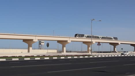 A-view-of-Metro-train-passing-through-flyover-above-the-highway