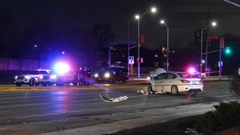 Police-cars-near-a-white-crashed-car-in-a-street-in-Mississauga,-Canada