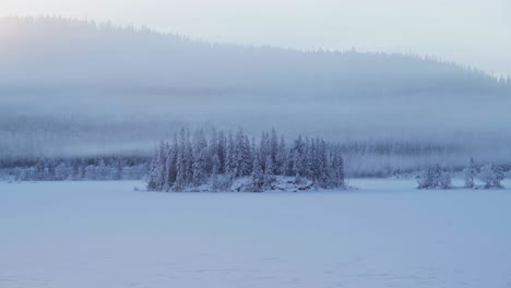 Clouds-With-Fog-Rolling-Over-Forest-And-Mountain-At-Winter-Near-Trondheim,-Norway