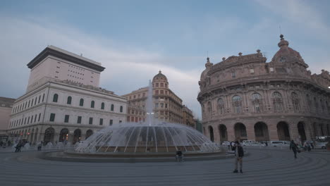 Piazza-De-Ferrari-square-in-Genova,-Genoa,-Liguria-at-sunset