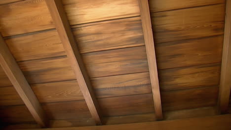 Pan-across-hinoki-wood-ceiling-and-rafters-of-Japanese-house