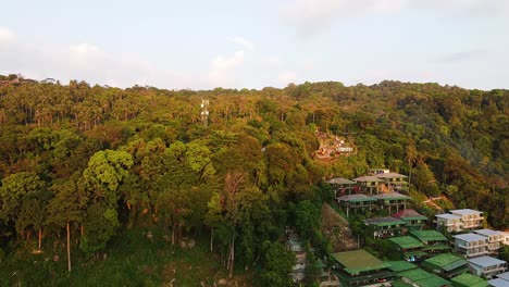 Aerial-static-view-of-Phi-Phi-Don-forest-with-part-of-its-village-at-foot