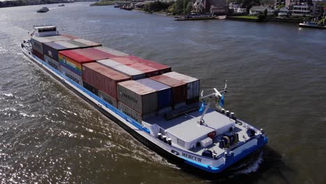 Container-Ship-Of-Mercur-Navigates-The-River-In-Kinderdijk-Village-At-Daytime