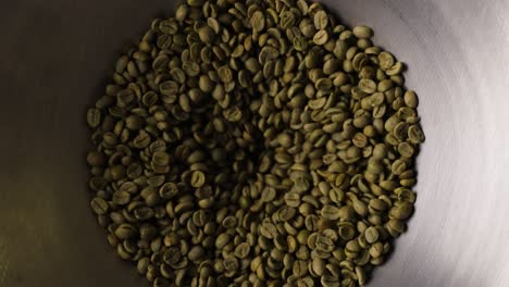 Coffee-beans-before-they-are-roasted-getting-pulled-into-the-drum-roaster